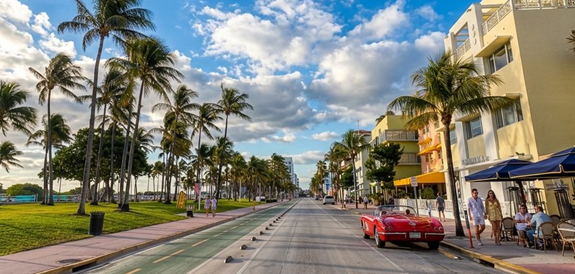 Convertible rental car driving on coastal highway near Miami